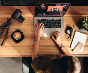 Person editing a video on a laptop