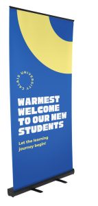 roller banner stand with banner welcoming students back to school