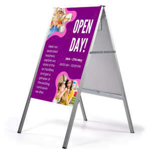 a board pavement sign advertising a primary school open day