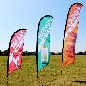 three different size feather flags