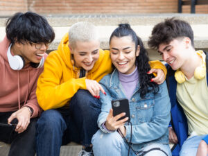 Young people smiling at phone