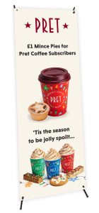 A tensioned banner promoting the coffee chain Pret's Christmas drink range.